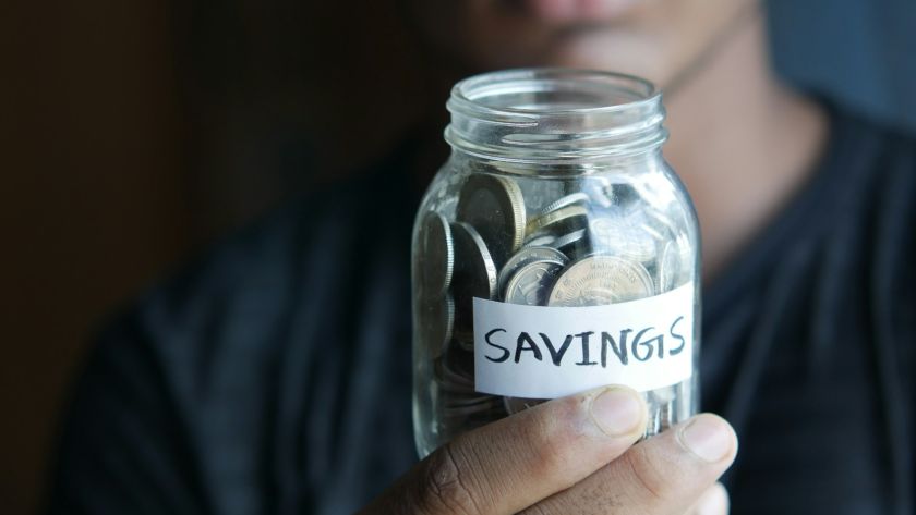 coins-on-a-mason-jar-indicating-savings
