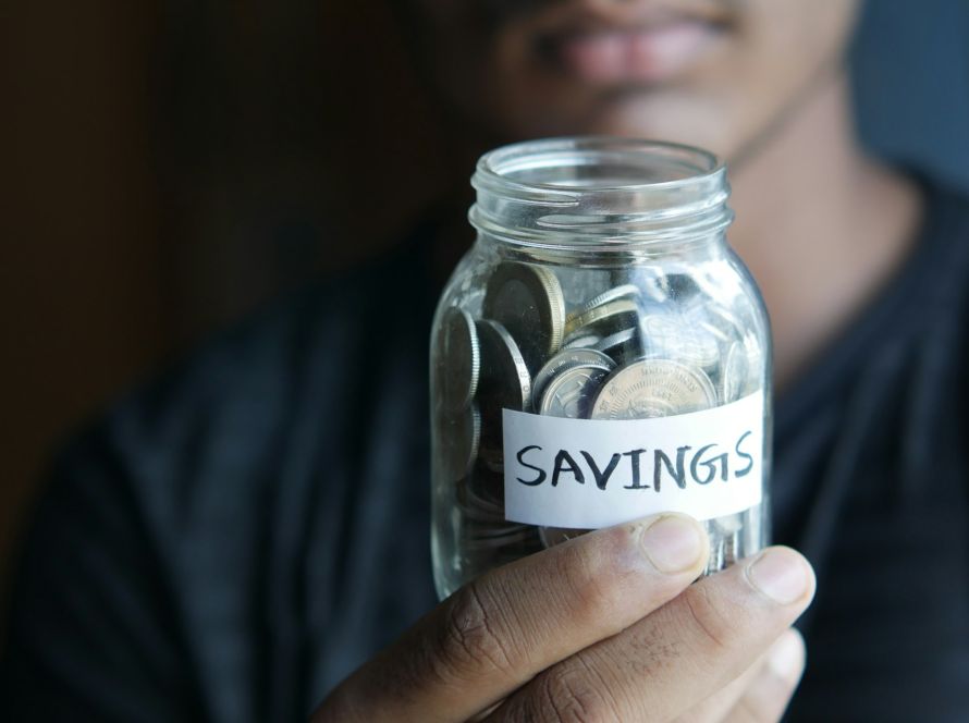 coins-on-a-mason-jar-indicating-savings